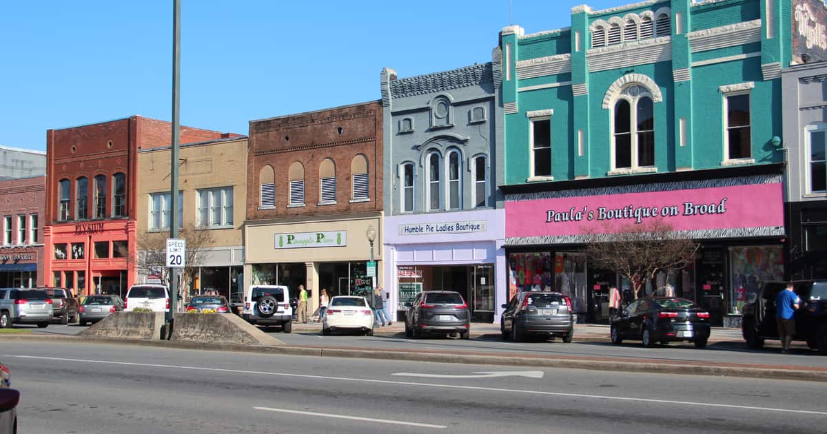 Colorful storefronts line a downtown block, the kind of multi-location footprint franchise SEO keeps consistent everywhere.