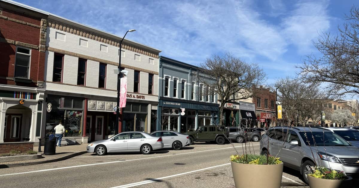 Sunny small-town main street of independent storefronts, the businesses local SEO for small business is built to help