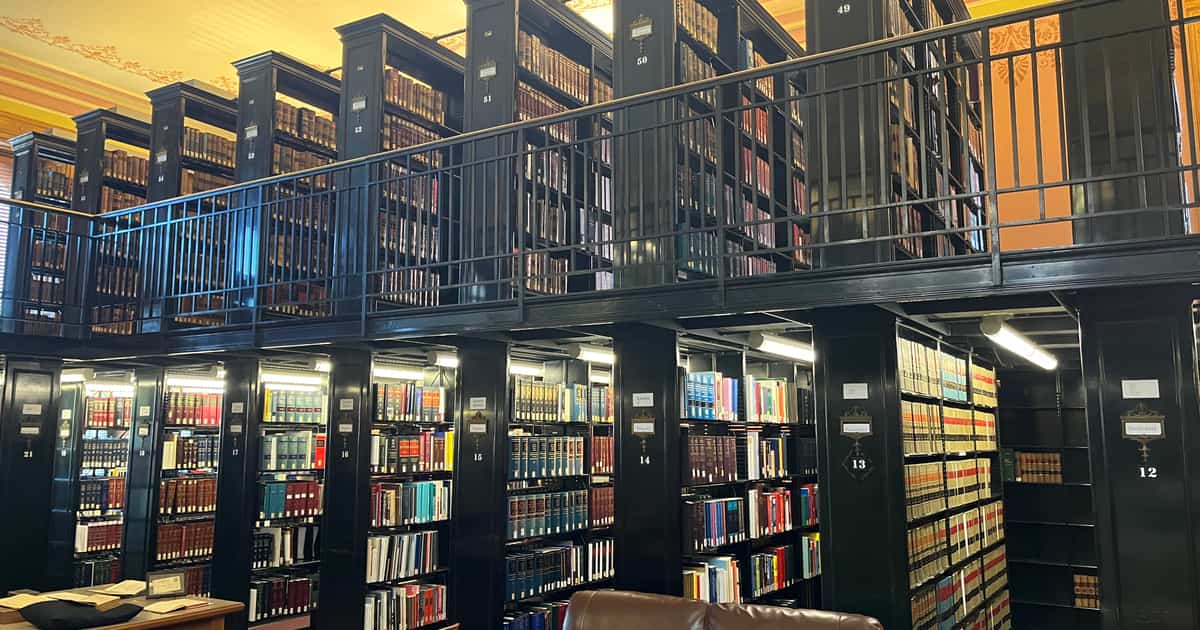 A law firm's two-story library with leather seating, the setting law firm citation management supports.