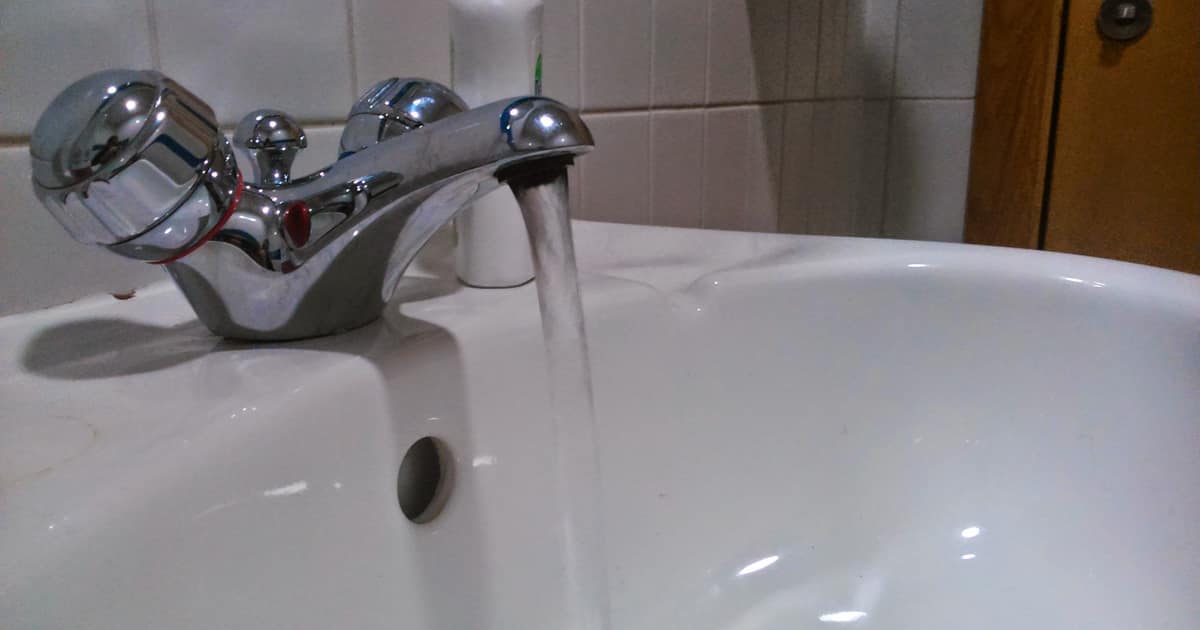 Water runs from a bathroom sink tap, the everyday call that local SEO for plumbers is built to win.